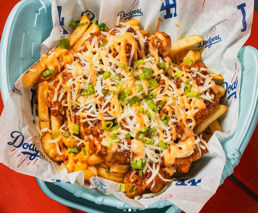 Orange chicken fries are shown in a bowl shaped like a glove