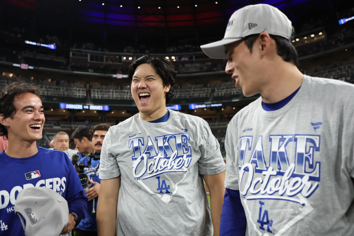 Shohei Ohtani and Roki Sasaki celebrate the Dodgers winning a playoff series in Atlanta