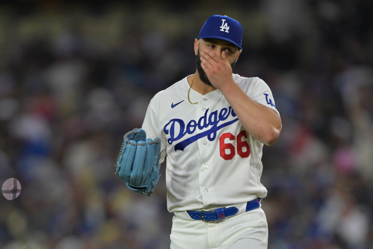 Apr 1, 2026; Los Angeles, California, USA; Los Angeles Dodgers pitcher Tanner Scott (66) reacts on the mound after giving up a two-run home run to Cleveland Guardians third baseman Jose Ramirez (11) in the eighth inning at Dodger Stadium. Mandatory Credit: Jayne Kamin-Oncea-Imagn Images