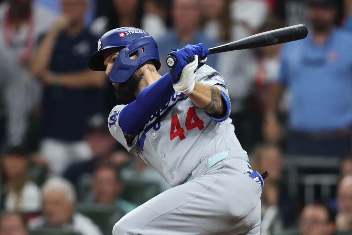 Oct 7, 2026; Cumberland, Georgia, USA; Los Angeles Dodgers outfielder Andy Pages (44) hits a two RBI single against the Atlanta Braves during the seventh inning in game four of the NLDS for the 2026 MLB Playoffs at Truist Park. Mandatory Credit: Brett Davis-Imagn Images