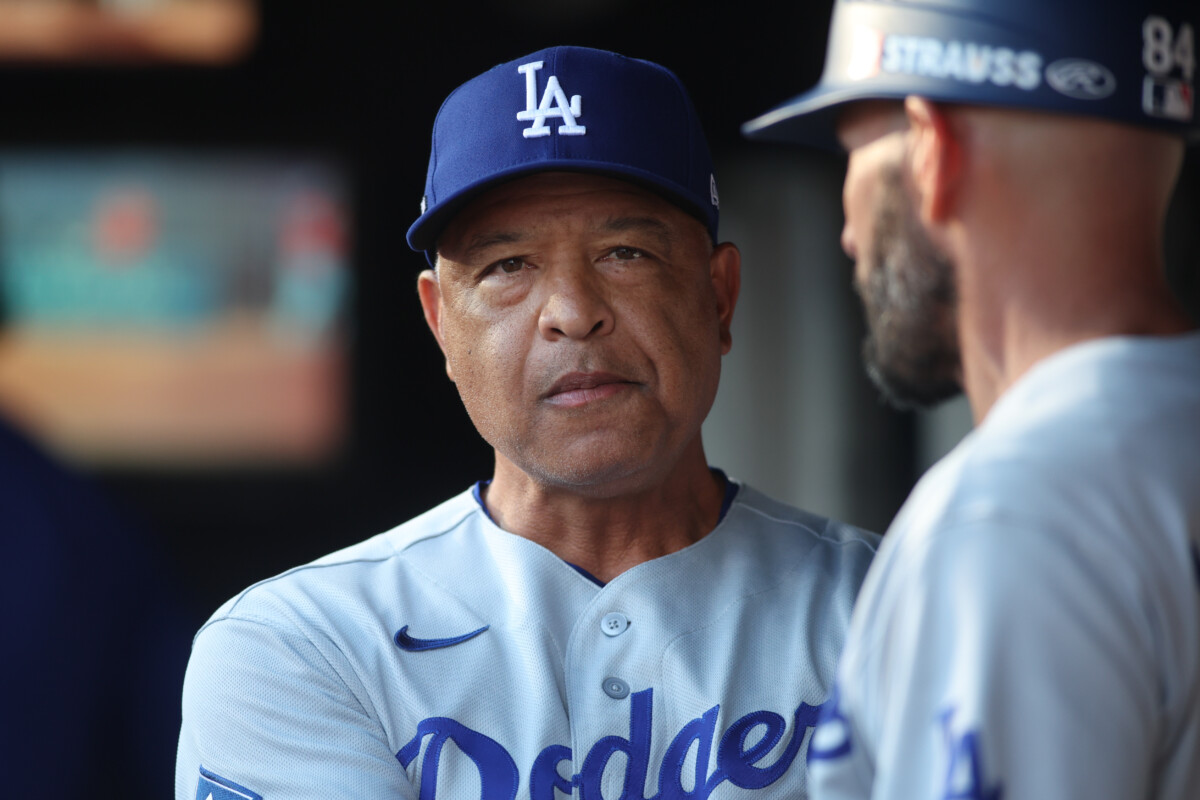 Oct 6, 2026; Cumberland, Georgia, USA; Los Angeles Dodgers manager Dave Roberts (30) in the dugout in game three of the NLDS for the 2026 MLB Playoffs against the Atlanta Braves at Truist Park. Mandatory Credit: Brett Davis-Imagn Images