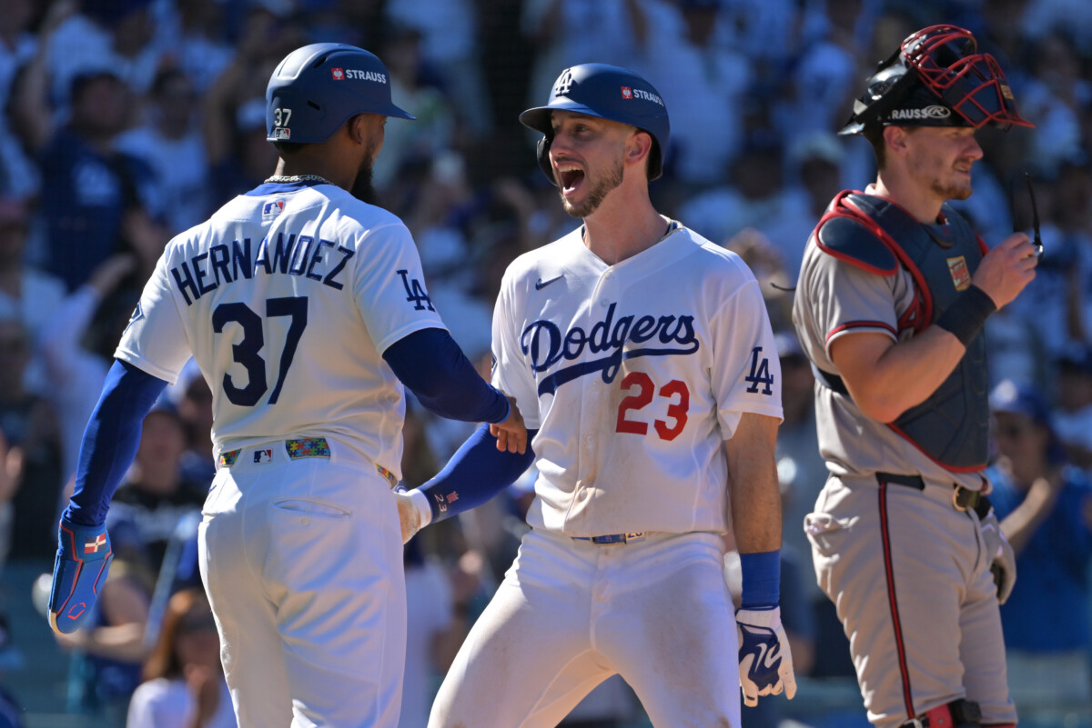 Oct 3, 2026; Los Angeles, California, USA; Los Angeles Dodgers outfielder Teoscar Hernandez (37) and outfielder Kyle Tucker (23) react after Tucker hit a two run home run during the sixth inning of game one of the NLDS against the Atlanta Braves for the 2026 MLB Playoffs at Uniqlo Field at Dodger Stadium. Mandatory Credit: Jayne Kamin-Oncea-Imagn Images