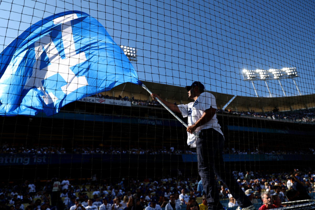 Oct 9, 2025; Los Angeles, California, USA; Los Angeles Dodgers fans during game four of the NLDS round for the 2025 MLB playoffs against the Philadelphia Phillies at Dodger Stadium. Mandatory Credit: Kiyoshi Mio-Imagn Images
