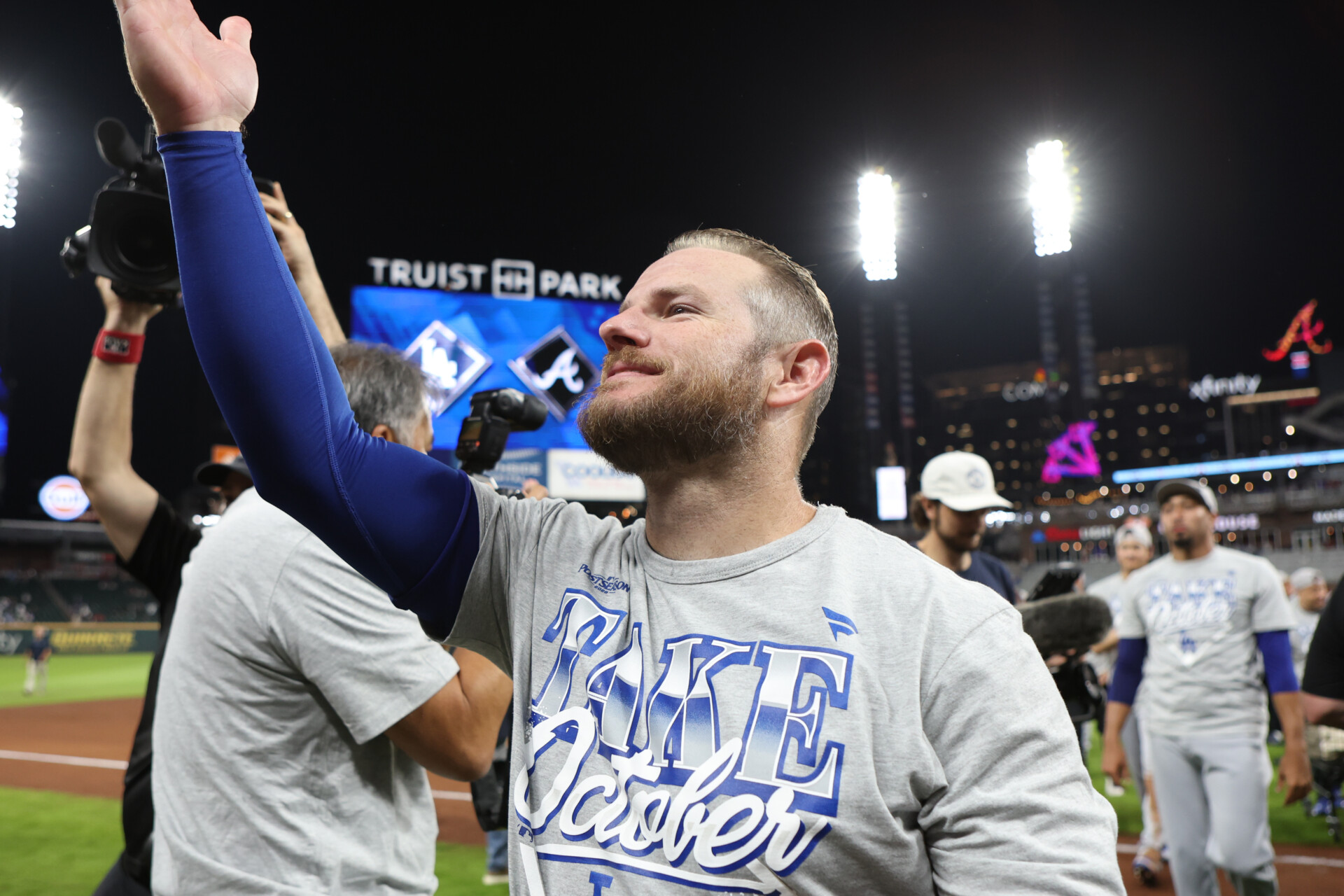 Oct 7, 2026; Cumberland, Georgia, USA; Los Angeles Dodgers third baseman Max Muncy (13) celebrates after defeating the Atlanta Braves in game four of the NLDS for the 2026 MLB Playoffs at Truist Park. Mandatory Credit: Brett Davis-Imagn Images