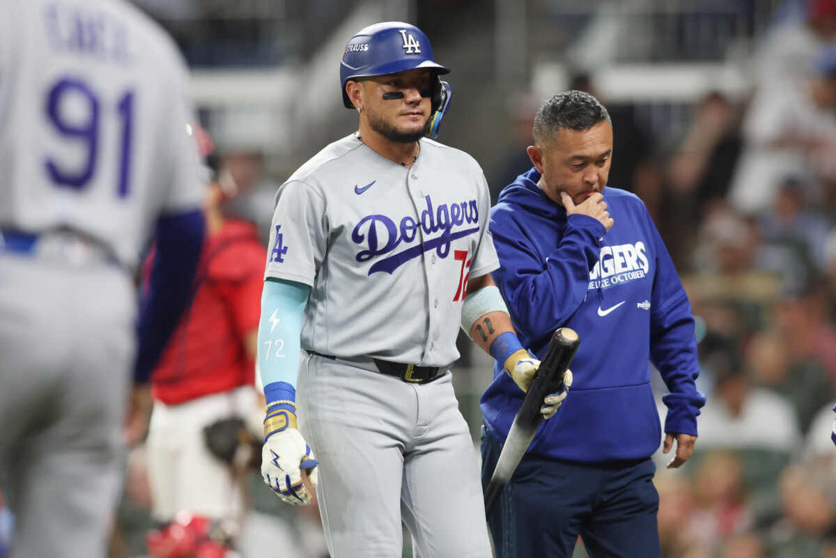 Oct 6, 2026; Cumberland, Georgia, USA; iLos Angeles Dodgers second baseman Miguel Rojas (72) leaves the game after hitting a foul ball off his body against the Atlanta Braves in game three of the NLDS for the 2026 MLB Playoffs at Truist Park. Mandatory Credit: Brett Davis-Imagn Images