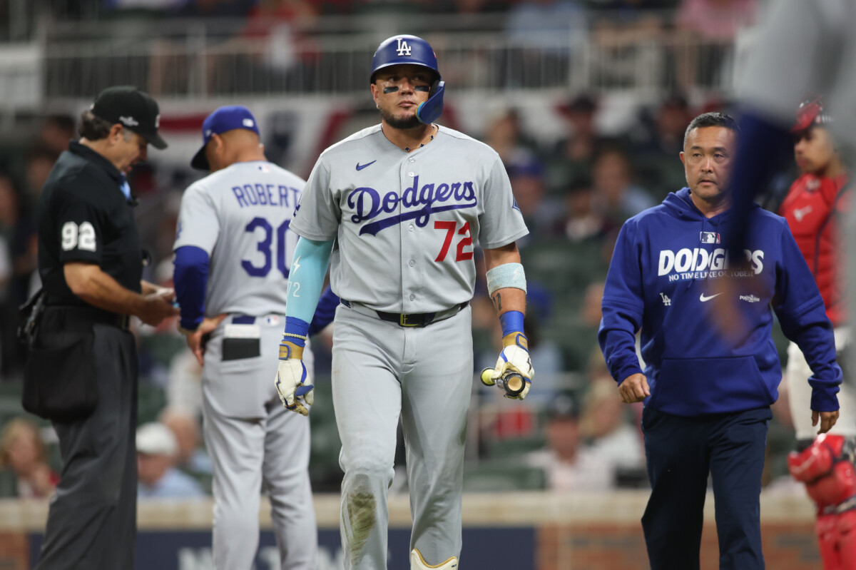 Oct 6, 2026; Cumberland, Georgia, USA; iLos Angeles Dodgers second baseman Miguel Rojas (72) leaves the game after hitting a foul ball off his body against the Atlanta Braves in game three of the NLDS for the 2026 MLB Playoffs at Truist Park. Mandatory Credit: Brett Davis-Imagn Images