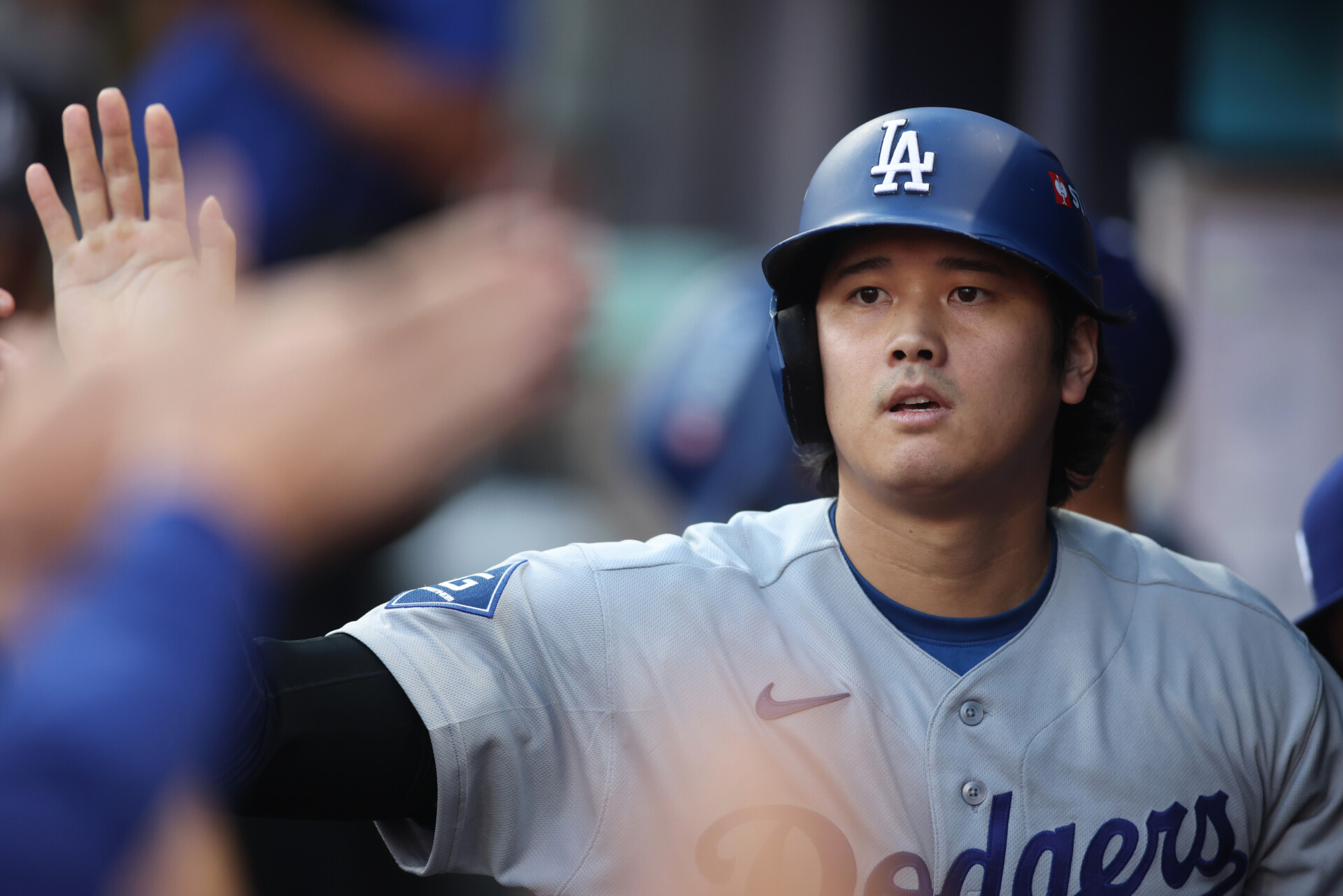 Oct 7, 2026; Cumberland, Georgia, USA; Los Angeles Dodgers pitcher Shohei Ohtani (17) celebrates after scoring a run against the Atlanta Braves during the second inning in game four of the NLDS for the 2026 MLB Playoffs at Truist Park. Mandatory Credit: Brett Davis-Imagn Images
