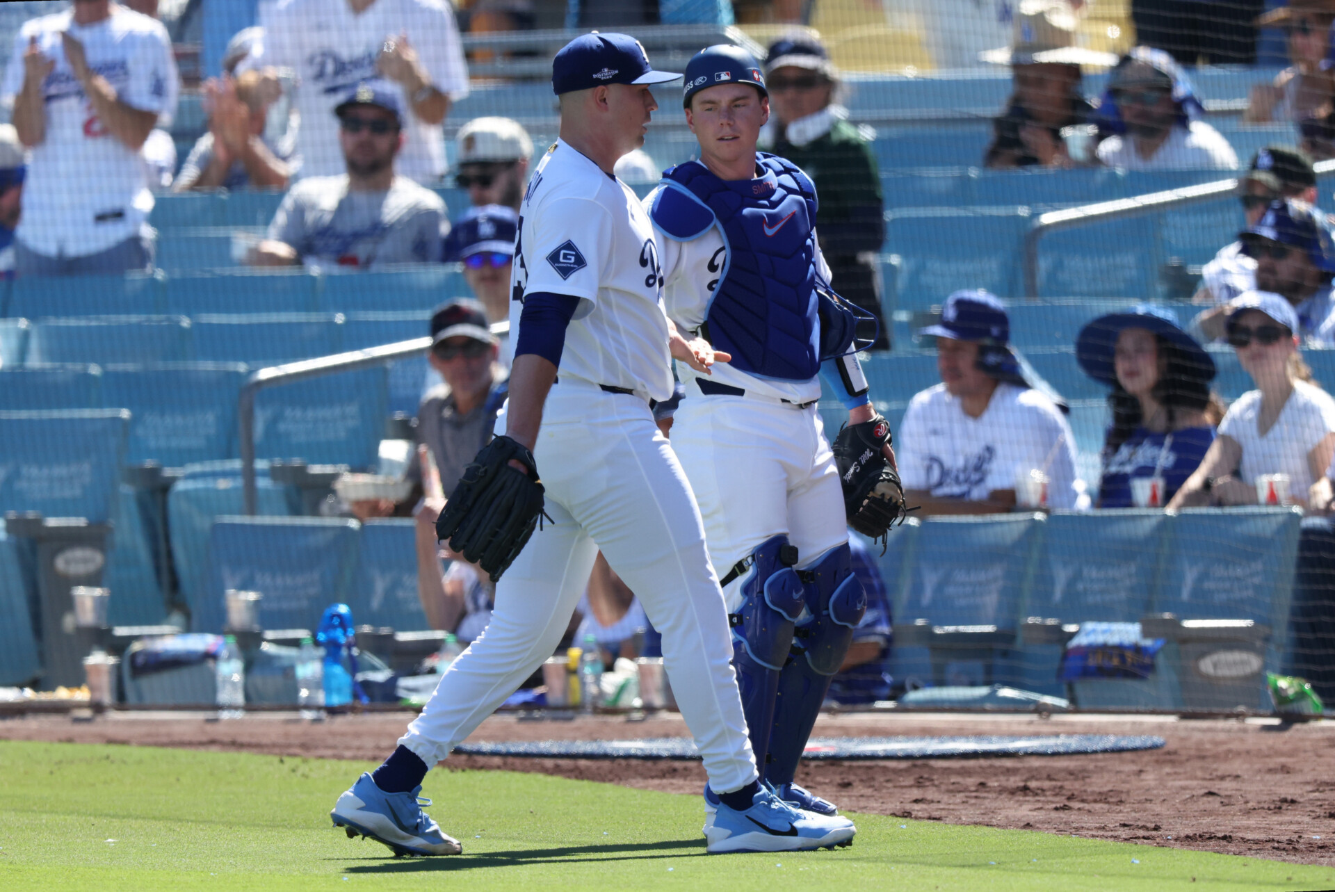 Oct 3, 2026; Los Angeles, California, USA;  Los Angeles Dodgers pitcher Tarik Skubal (29) and catcher Will Smith (16) walk to the dugout during the third inning of game one of the NLDS against the Atlanta Braves for the 2026 MLB Playoffs at Uniqlo Field at Dodger Stadium.  Mandatory Credit: Kiyoshi Mio-Imagn Images
