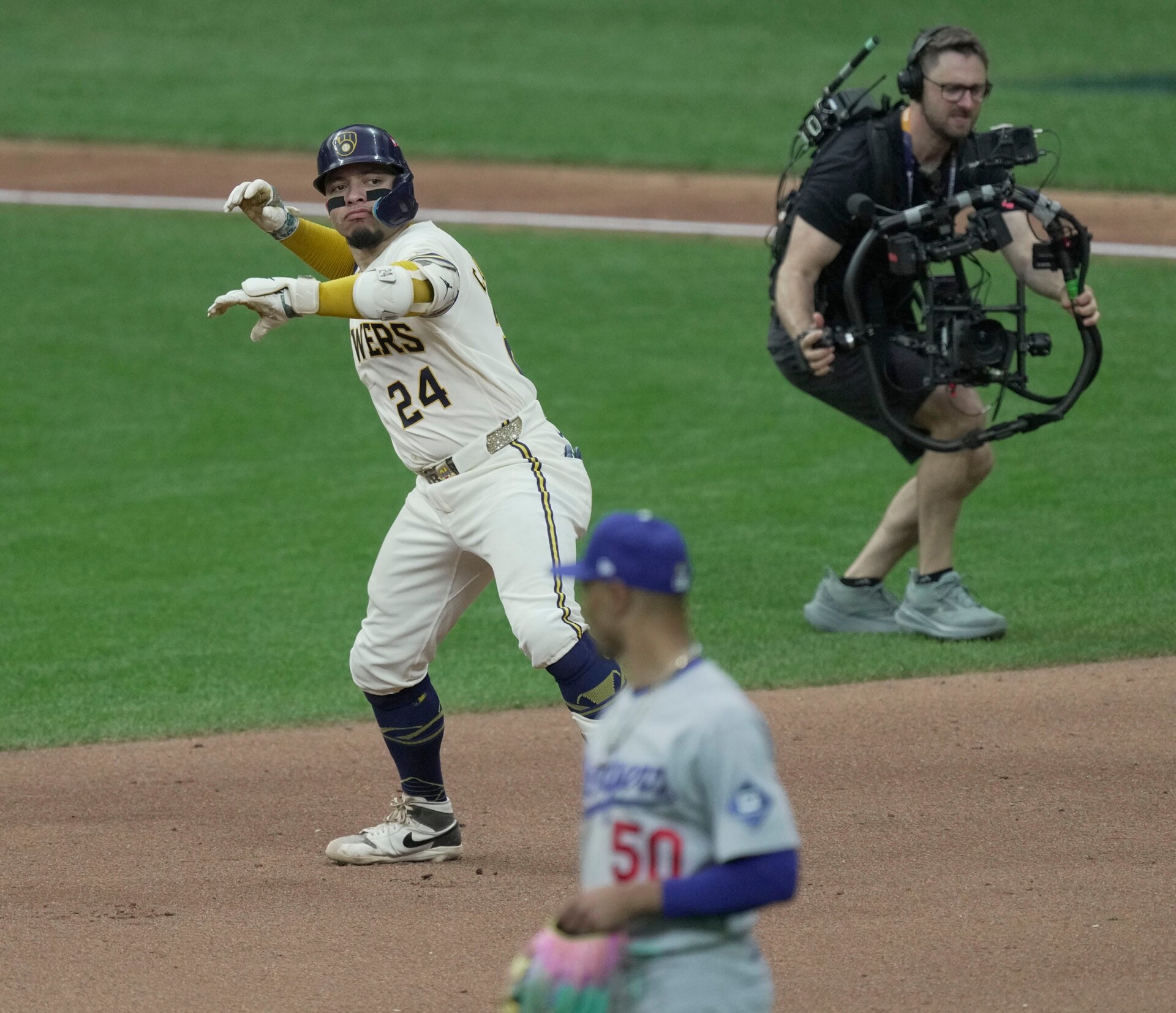 Milwaukee Brewers catcher William Contreras (24) celebrates his home run during the fifth inning of their National League Championship Series game against the Los Angeles Dodgers at American Family Field on Oct 12, 2026. Mark Hoffman / Milwaukee Journal Sentinel